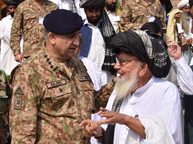 general qamar interacts with a tribal elder during his visit to miranshah on friday photo ispr