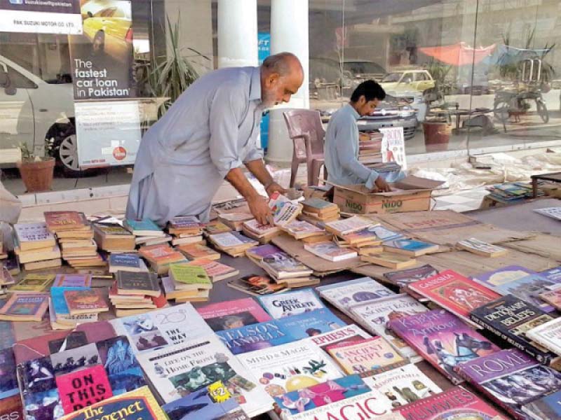 fareedul haq arranges his weekly bookstall on bank road where children select their favourite reads photos express