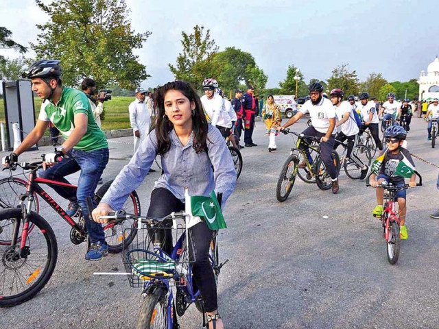 people take part in a bicycle rally on world tourism day at f 9 park photo app people take part in a bicycle rally on world tourism day at f 9 park photo app