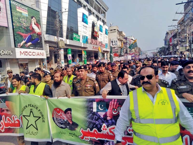 police officials hold a rally to protest human rights violations in kashmir photo express