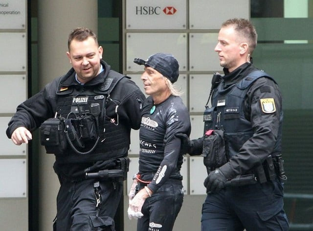 french urban climber alain robert popularly known as the quot french spiderman quot is led away by police after climbing the 154 metre high 500 foot high skyper building in frankfurt photo afp french urban climber alain robert popularly known as the quot french spiderman quot is led away by police after climbing the 154 metre high 500 foot high skyper building in frankfurt photo afp