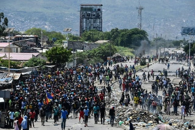 people march in the cite soleil neighborhood during protests on september 27 2019 photo afp people march in the cite soleil neighborhood during protests on september 27 2019 photo afp