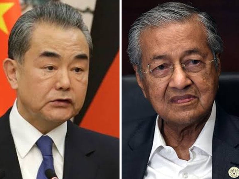 foreign minister of the people 039 s republic of china wang yi and prime minister of malaysia mahathir bin mohamad photo file