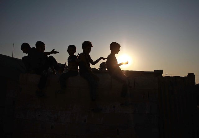 displaced syrian children pose for a picture at a camp for displaced syrians in atme in the northwestern idlib province near the border with turkey photo afp displaced syrian children pose for a picture at a camp for displaced syrians in atme in the northwestern idlib province near the border with turkey photo afp