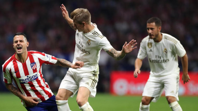 real hold off atletico in tight derby to grab top spot in spain real hold off atletico in tight derby to grab top spot in spain