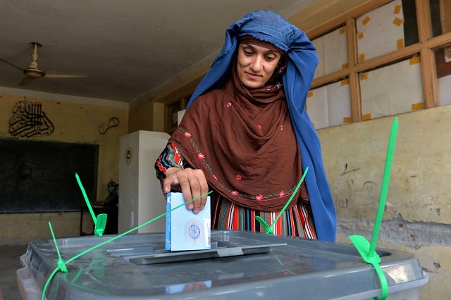 a woman casts her vote at a polling station in jalalabad on september 28 2019 photo afp