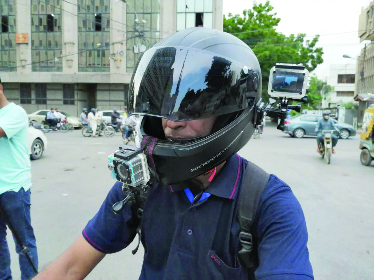 abdul qudoos takes his followers along on a ride across some of the city s most ghettoised neighbourhoods through the two cameras which he has retrofitted on his helmet photo express