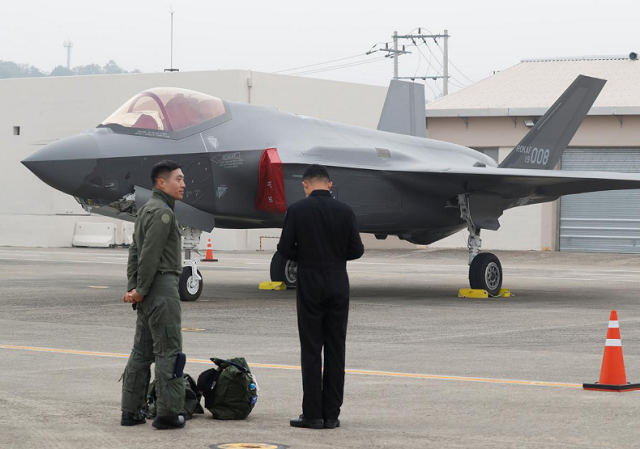 a south korean fighter pilot l stands next to his f 35 stealth fighter during a ceremony to mark the 71st armed forces day at the air force base in daegu south korea photo reuters a south korean fighter pilot l stands next to his f 35 stealth fighter during a ceremony to mark the 71st armed forces day at the air force base in daegu south korea photo reuters