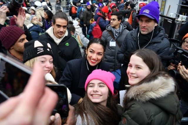 us representative alexandria ocasio cortez d ny poses for a photo with marchers as she attends the women 039 s march in new york photo afp file us representative alexandria ocasio cortez d ny poses for a photo with marchers as she attends the women 039 s march in new york photo afp file