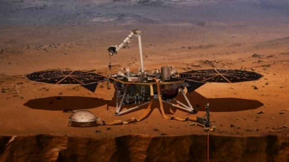 an nasa illustration of the insight lander on mars and the dome shaped quake detector that has picked up seismic rumbles photo afp
