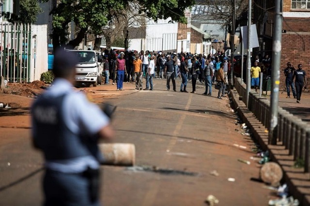 gangs of aggressors armed with sticks and machetes attacked businesses in south africa 039 s financial capital last month during deadly xenophobic attacks photo afp