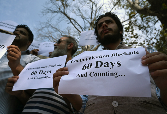 journalists hold signs during a protest against the ongoing restrictions of the internet and mobile phone networks at the kashmir press club during a lockdown in srinagar on october 3 2019 photo afp journalists hold signs during a protest against the ongoing restrictions of the internet and mobile phone networks at the kashmir press club during a lockdown in srinagar on october 3 2019 photo afp