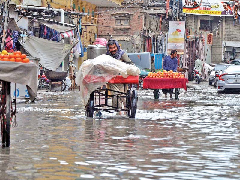 a view of jamia masjid road after heavy rain in the city photo inp