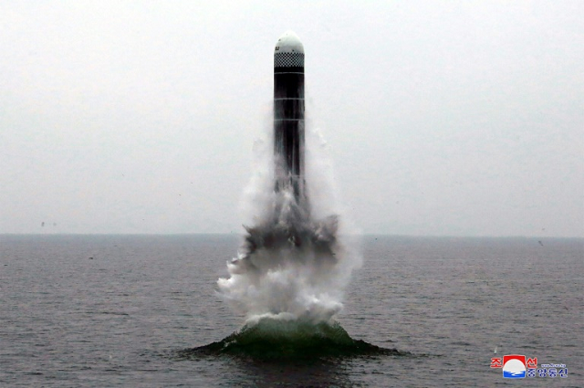 analysts say the missile was likely launched from an underwater barge or other stationary object not from a submarine photo afp