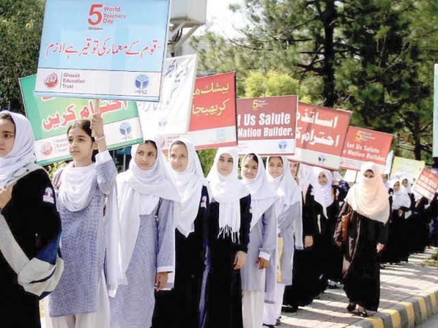 students carrying placards at world teachers day rally photo nni students carrying placards at world teachers day rally photo nni