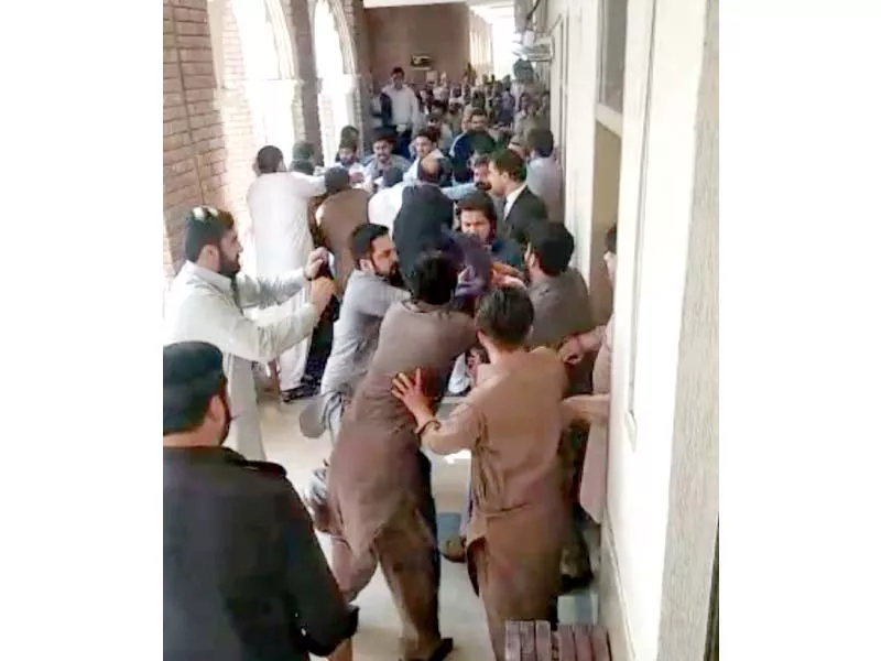 a man films the scene as two groups exchange blows in the judicial complex photo express a man films the scene as two groups exchange blows in the judicial complex photo express