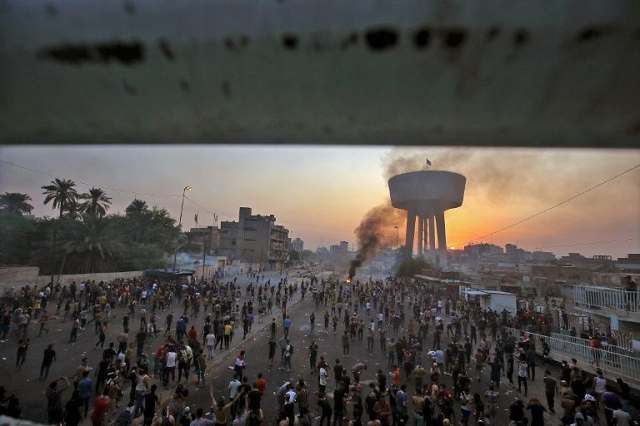 iraqi protesters gather for a demonstration against state corruption failing public services and unemployment at tayaran square in baghdad photo afp