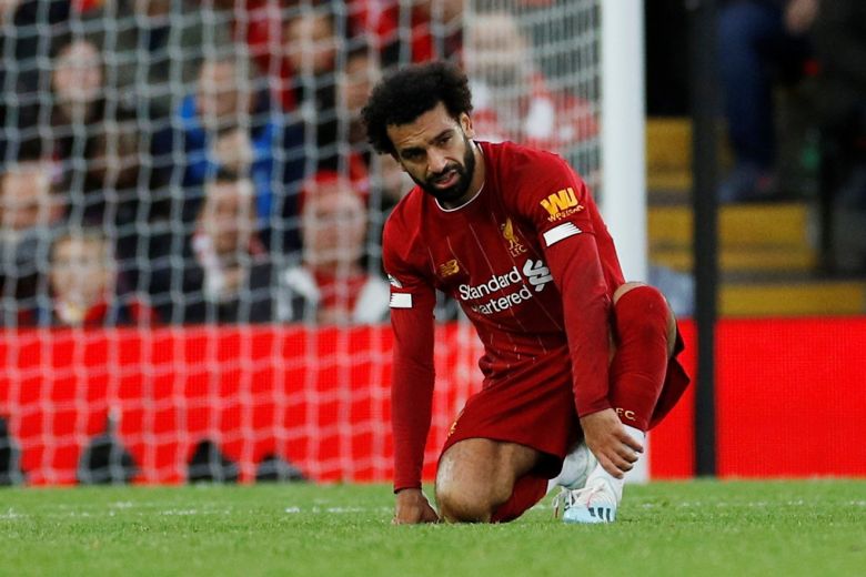 egyptian forward later limped out of the stadium with what appeared to be an ankle injury photo afp