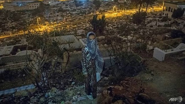 a moroccan addict stands in a cemetery overlooking tetouan a common spot for drug users photo afp a moroccan addict stands in a cemetery overlooking tetouan a common spot for drug users photo afp