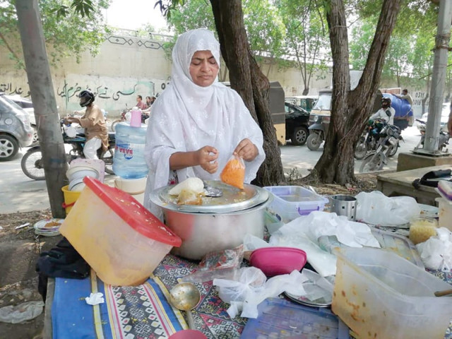 each day salma sets up shop on the corner of the street selling over 16 dishes prepared with love and care to meet the financial needs of her family photo express each day salma sets up shop on the corner of the street selling over 16 dishes prepared with love and care to meet the financial needs of her family photo express