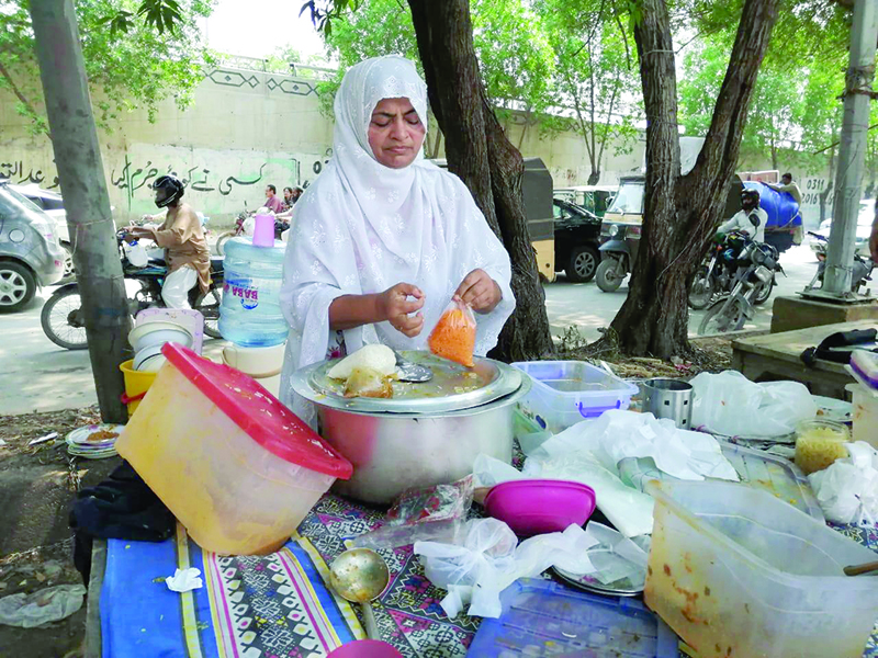 each day salma sets up shop on the corner of the street selling over 16 dishes prepared with love and care to meet the financial needs of her family photo express