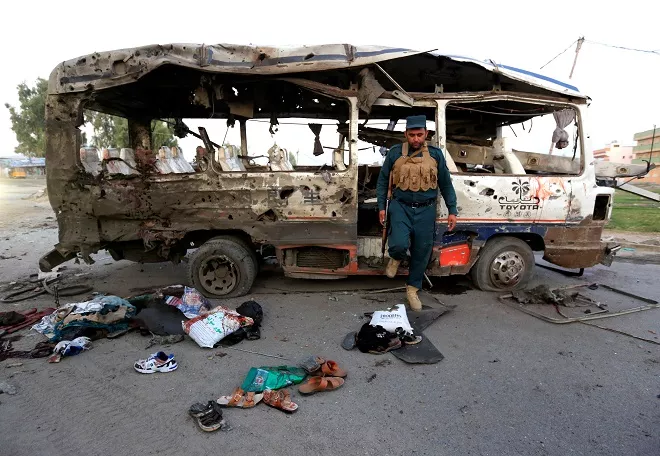 an afghan policeman inspects a damaged minibus after a blast in jalalabad afghanistan photo reuters an afghan policeman inspects a damaged minibus after a blast in jalalabad afghanistan photo reuters