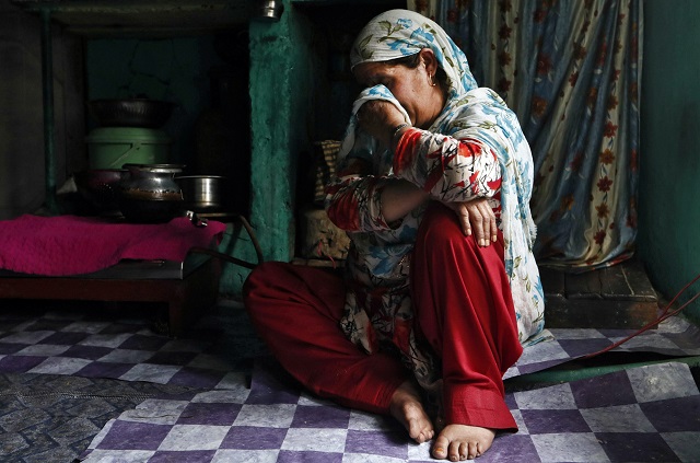 haseena malik mother of uzair maqbool malik reacts while speaking about her son inside her kitchen in south kashmir 039 s shopian town photo reuters