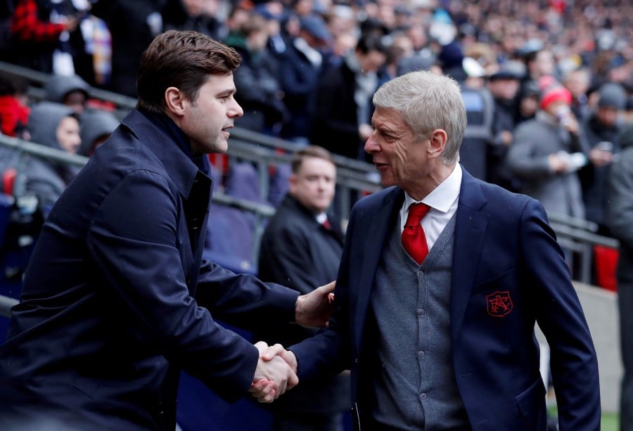 wenger says pochettino is almost paying for his own success and that the team is lacking the chemistry of previous seasons photo afp