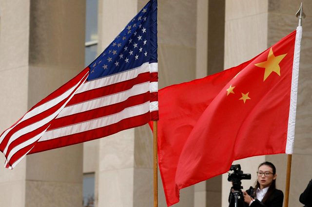 us and chinese flags are seen before defense secretary james mattis welcomes chinese minister of national defense gen wei fenghe to the pentagon in arlington virginia us november 9 2018 photo reuters