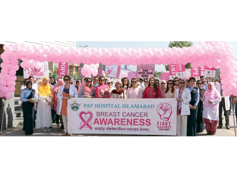 first lady samina alvi and pafwa president tazeen mujahid take part in a breast cancer awareness walk at the paf complex photo express