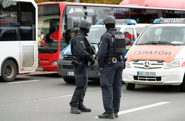 police officers stand guard near the site of a shooting in which two people were killed in halle germany october 9 2019 photo reuters police officers stand guard near the site of a shooting in which two people were killed in halle germany october 9 2019 photo reuters