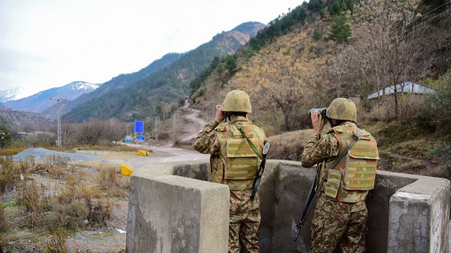 pakistan army personnel observe the loc photo reuters file