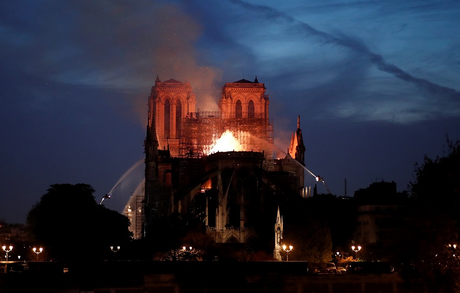 on 15 april 2019 a structure fire broke out beneath the roof of notre dame de paris cathedral in paris photo reuters