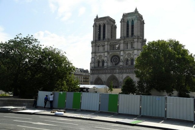 workers installed fencing around notre dame cathedral in august as they began lead clean up operations photo afp