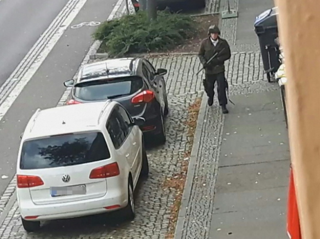 a video screenshot shows an armed man in the streets of halle on wednesday photo afp a video screenshot shows an armed man in the streets of halle on wednesday photo afp