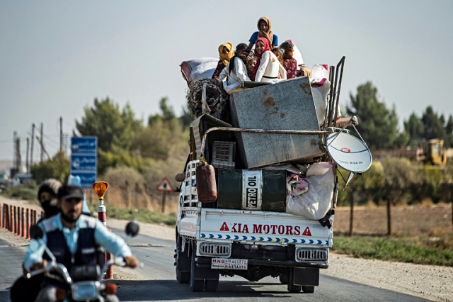 civilians fled their homes in vehicles or on foot with their belongings photo afp