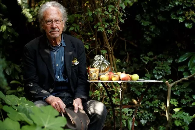 austrian author peter handke poses in his garden in chaville near paris following the announcement he won the 2019 nobel prize in literature photo reuters austrian author peter handke poses in his garden in chaville near paris following the announcement he won the 2019 nobel prize in literature photo reuters