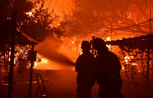 firefighters battle a wind driven wildfire called the saddle ridge fire in the early morning hours friday in porter ranch california us on october 11 2019 photo reuters firefighters battle a wind driven wildfire called the saddle ridge fire in the early morning hours friday in porter ranch california us on october 11 2019 photo reuters