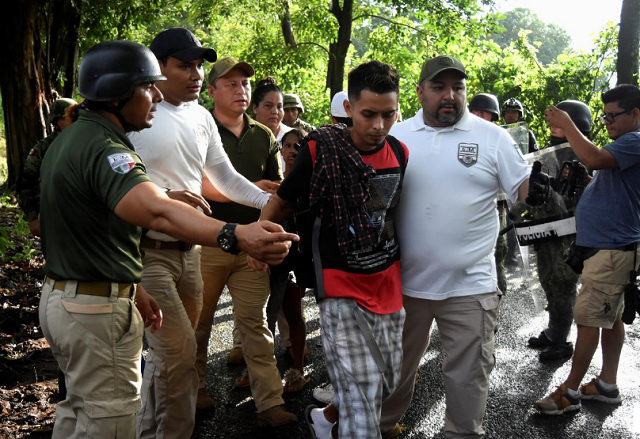 agents of the national migration institute inm detain a migrant during an operation by the national guard to halt a caravan of migrants from africa the caribbean and central america hours after they embarked toward the united states in tuzantan in chiapas state mexico photo reuters agents of the national migration institute inm detain a migrant during an operation by the national guard to halt a caravan of migrants from africa the caribbean and central america hours after they embarked toward the united states in tuzantan in chiapas state mexico photo reuters