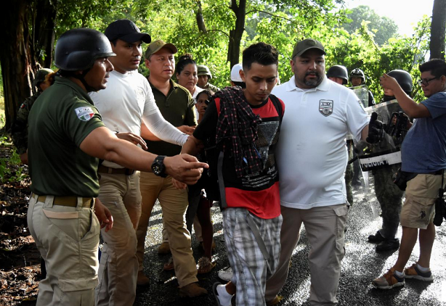 agents of the national migration institute inm detain a migrant during an operation by the national guard to halt a caravan of migrants from africa the caribbean and central america hours after they embarked toward the united states in tuzantan in chiapas state mexico photo reuters