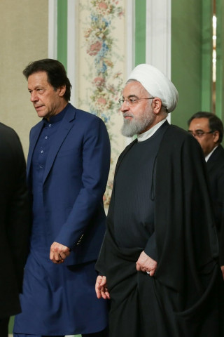 iranian president hassan rouhani walks with pakistani prime minister imran khan as they attend a press conference in tehran photo reuters iranian president hassan rouhani walks with pakistani prime minister imran khan as they attend a press conference in tehran photo reuters