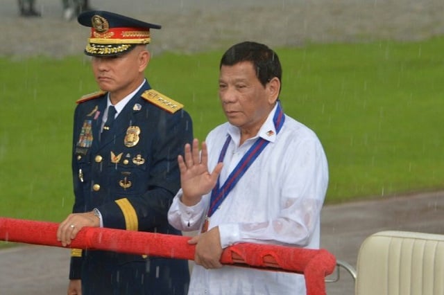 oscar albayalde pictured here next to president rodrigo duterte last year had led the national drug crackdown photo afp