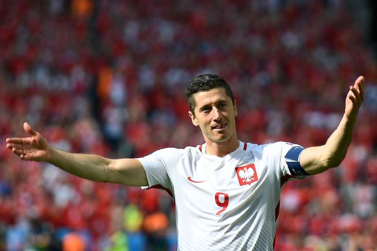 lewandowski s side remain three points clear of austria who won 1 0 in slovenia at the top of group g photo afp