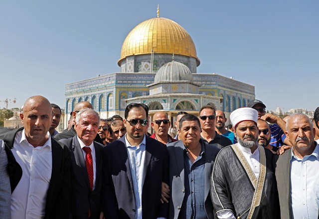 saudi football federation chief yasser almisehal c and members of the saudi football delegation visit the al aqsa mosque compound in the old city of jerusalem on october 14 2019 photo afp