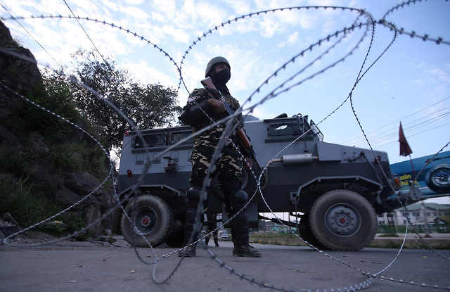 an indian security personnel stands guard on a deserted road during restrictions after scrapping of the special constitutional status for occupied kashmir by the indian government in srinagar august 23 2019 photo reuters