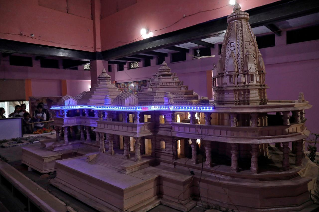 people look at a model of the proposed ram temple in ayodhya photo reuters