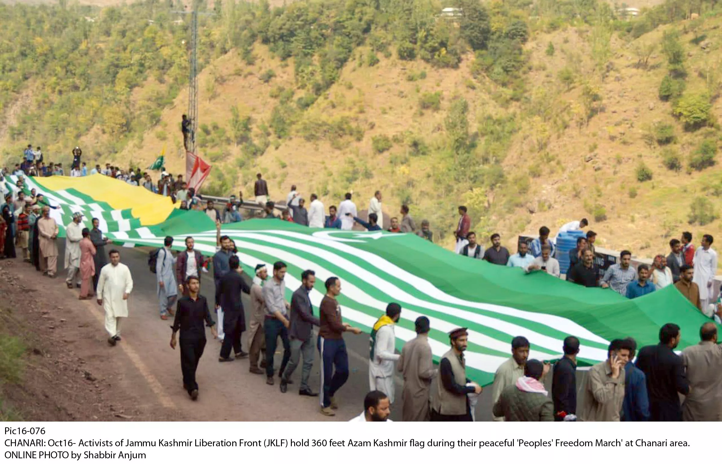 jklf supporters hold ajk flag during their protest near line of control on wednesday photo online jklf supporters hold ajk flag during their protest near line of control on wednesday photo online