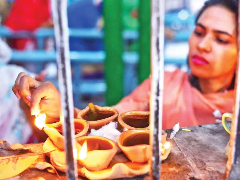 a woman lights a traditional oil lamp in lahore on the eve of data ganj baksh s 976th urs celebrations will begin on october 18 today and will end on october 20 photo online a woman lights a traditional oil lamp in lahore on the eve of data ganj baksh s 976th urs celebrations will begin on october 18 today and will end on october 20 photo online