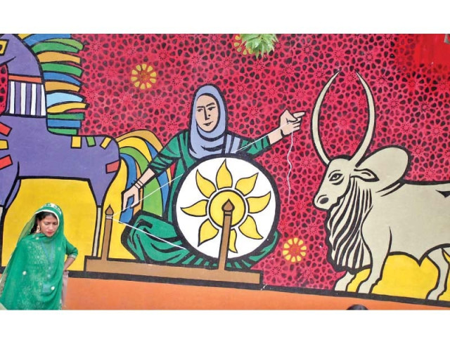 a rural woman walks past a mural at lok virsa on the last day of annual conference of rural women day organised by the potohar organisation for development advocacy photo online a rural woman walks past a mural at lok virsa on the last day of annual conference of rural women day organised by the potohar organisation for development advocacy photo online
