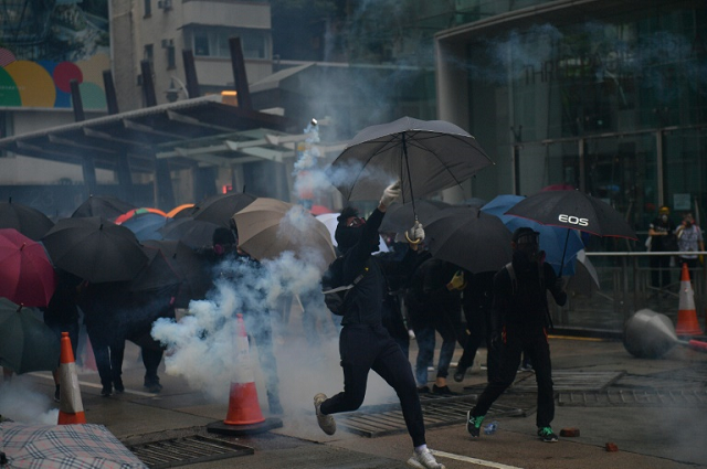 hong kong police fired tear gas at pro democracy protesters after tens of thousands hit the streets once more photo afp